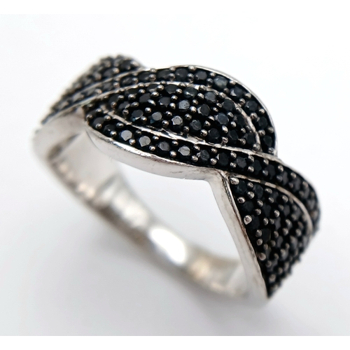 922 - An Early 21 st Century Sterling Silver Black Onyx Pave Ring, Size Q. The Ring measures 1cm Wide at t... 