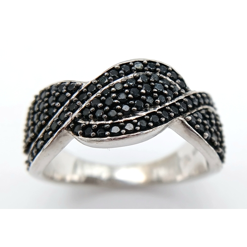 922 - An Early 21 st Century Sterling Silver Black Onyx Pave Ring, Size Q. The Ring measures 1cm Wide at t... 