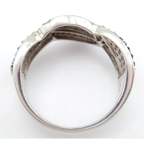 922 - An Early 21 st Century Sterling Silver Black Onyx Pave Ring, Size Q. The Ring measures 1cm Wide at t... 