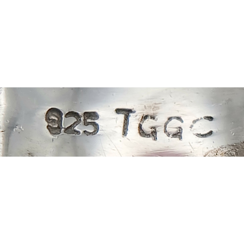 922 - An Early 21 st Century Sterling Silver Black Onyx Pave Ring, Size Q. The Ring measures 1cm Wide at t... 