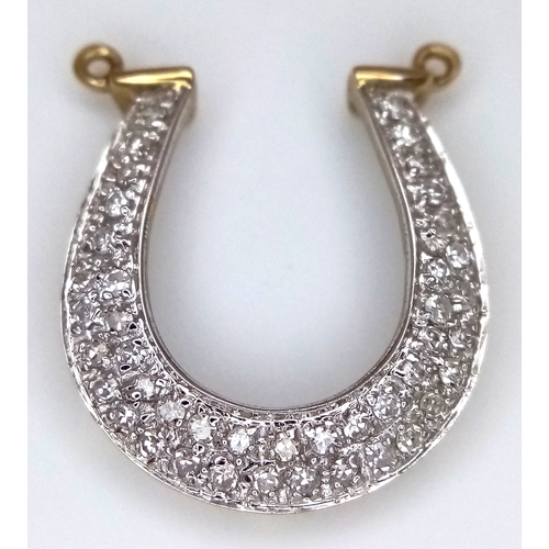 942 - A fancy 9K yellow gold Diamond horseshoe lucky charm/pendant. Total weight 1.42G.