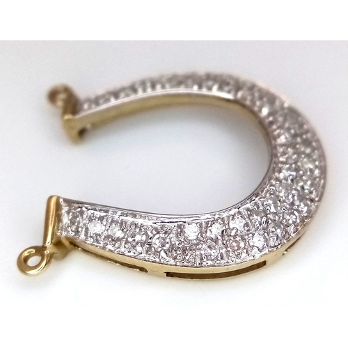 942 - A fancy 9K yellow gold Diamond horseshoe lucky charm/pendant. Total weight 1.42G.