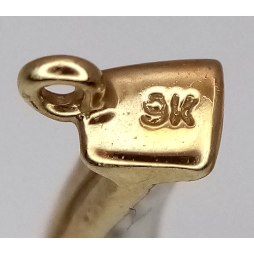 942 - A fancy 9K yellow gold Diamond horseshoe lucky charm/pendant. Total weight 1.42G.