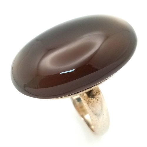 957 - A Vintage Sterling Silver Blue Chalcedony Cabochon Statement Ring, Size K. The Ring is set with a im... 