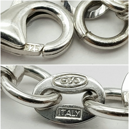 979 - A STERLING SILVER CRYSTAL AND HEARTS CHARM BRACELET. 9.6G. JSIL-9002