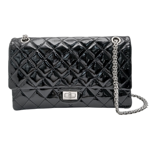 601 - A Chanel Black Patent Leather Classic Double Flap Bag.Black leather exterior with silver-toned hard... 