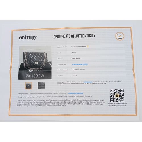 601 - A Chanel Black Patent Leather Classic Double Flap Bag.Black leather exterior with silver-toned hard... 