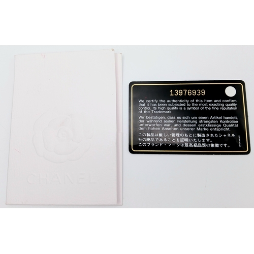 601 - A Chanel Black Patent Leather Classic Double Flap Bag.Black leather exterior with silver-toned hard... 