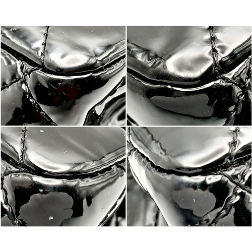 601 - A Chanel Black Patent Leather Classic Double Flap Bag.Black leather exterior with silver-toned hard... 