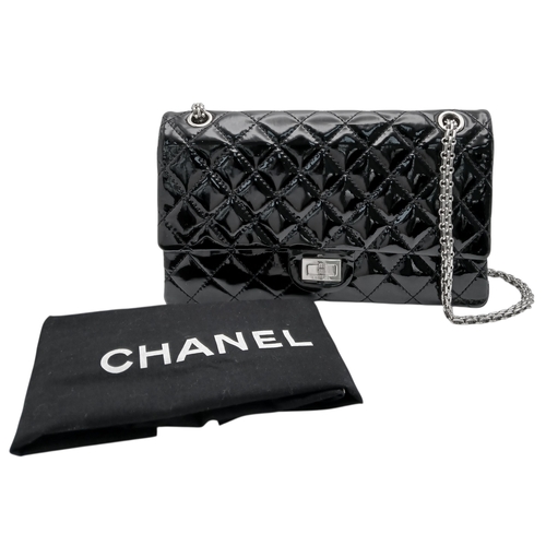 601 - A Chanel Black Patent Leather Classic Double Flap Bag.Black leather exterior with silver-toned hard... 