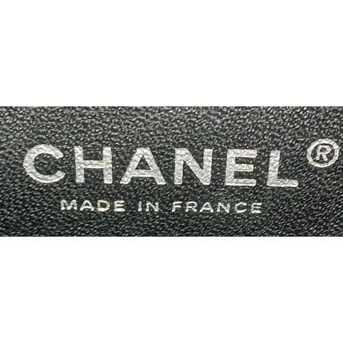 601 - A Chanel Black Patent Leather Classic Double Flap Bag.Black leather exterior with silver-toned hard... 