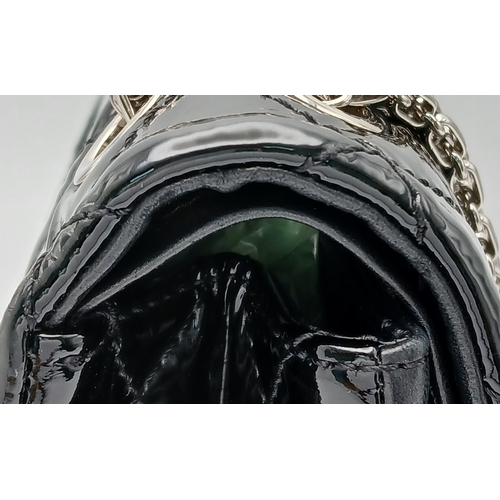 601 - A Chanel Black Patent Leather Classic Double Flap Bag.Black leather exterior with silver-toned hard... 