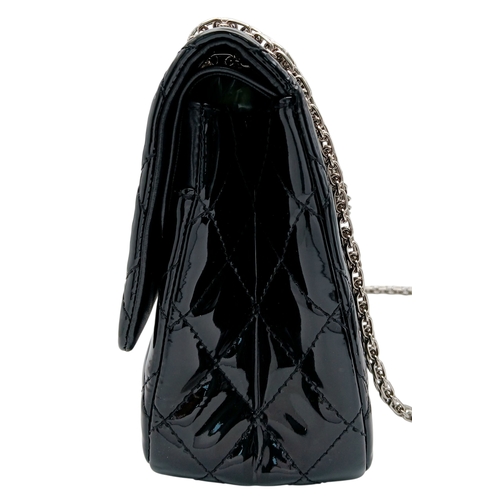 601 - A Chanel Black Patent Leather Classic Double Flap Bag.Black leather exterior with silver-toned hard... 