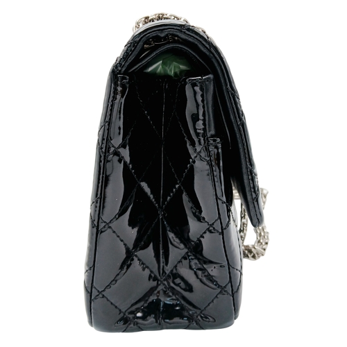 601 - A Chanel Black Patent Leather Classic Double Flap Bag.Black leather exterior with silver-toned hard... 