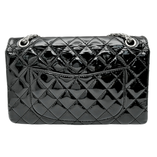 601 - A Chanel Black Patent Leather Classic Double Flap Bag.Black leather exterior with silver-toned hard... 