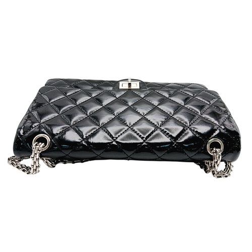 601 - A Chanel Black Patent Leather Classic Double Flap Bag.Black leather exterior with silver-toned hard... 