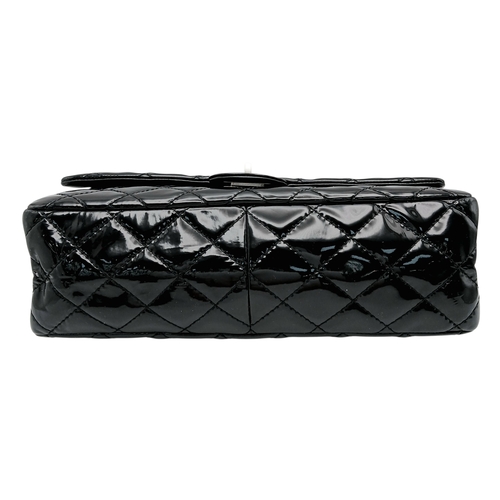 601 - A Chanel Black Patent Leather Classic Double Flap Bag.Black leather exterior with silver-toned hard... 