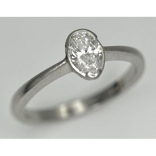 867 - A PLATINUM DIAMOND SOLITAIRE RING. DIAMOND WEIGHT 0.50CT. PEAR SHAPE CUT DIAMOND RUBOVER SET. TOTAL ... 