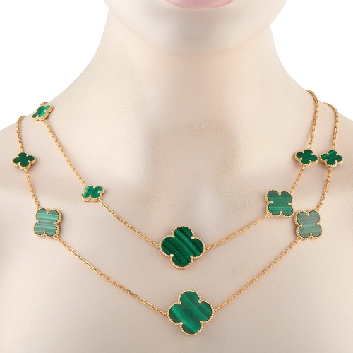 259 - A Van Cleef & Arpels Magic Alhambra 18K Yellow Gold Malachite 16 Motif Necklace.  On this 16-Motif d... 