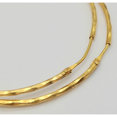 165 - A PAIR OF LARGE HOOP EARRINGS IN 18K GOLD .   6.8gms