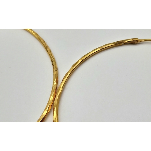 165 - A PAIR OF LARGE HOOP EARRINGS IN 18K GOLD .   6.8gms