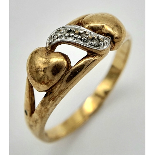 557 - A 9K GOLD DOUBLE HEART RING WITH STONE SET WHITE GOLD ATTACHMENT .        2.2gms    size N