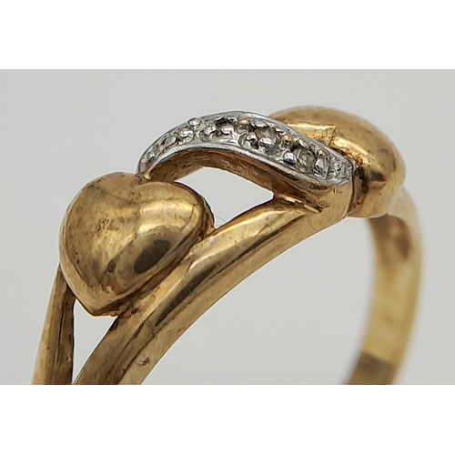 557 - A 9K GOLD DOUBLE HEART RING WITH STONE SET WHITE GOLD ATTACHMENT .        2.2gms    size N