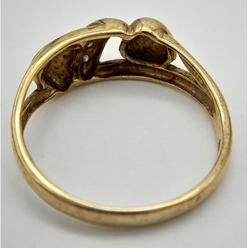 557 - A 9K GOLD DOUBLE HEART RING WITH STONE SET WHITE GOLD ATTACHMENT .        2.2gms    size N