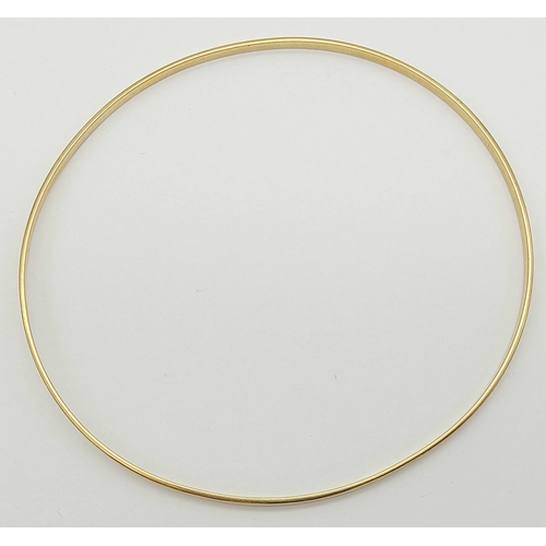 597 - A 9K GOLD SLIMLINE BANGLE .      4.1gms