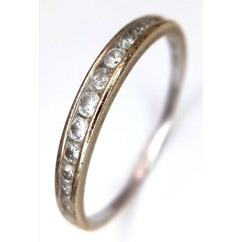 604 - A 9K White Gold Diamond Half Eternity Ring. Size O 1/2. 1.1g.