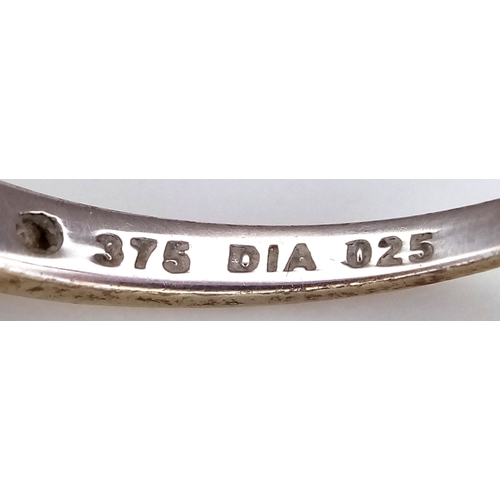 604 - A 9K White Gold Diamond Half Eternity Ring. Size O 1/2. 1.1g.