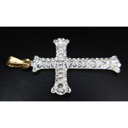654 - A 9K Yellow Gold (tests as) White Stone Cross Pendant. 3.5cm. 0.6g.