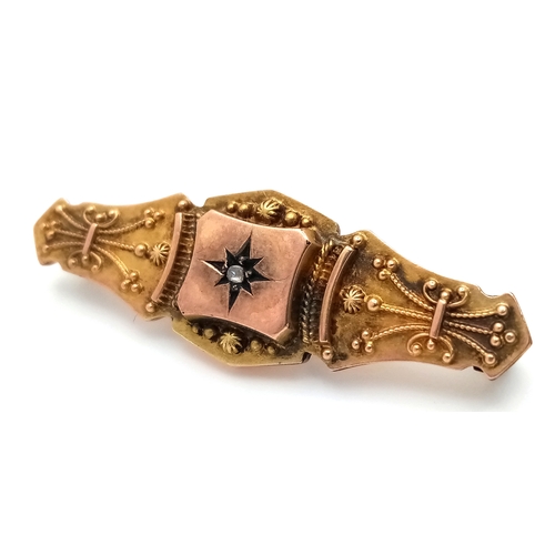 765 - An Antique 9K Yellow Diamond Brooch. Pin has been replaced. 4cm. 2.2g total weight.