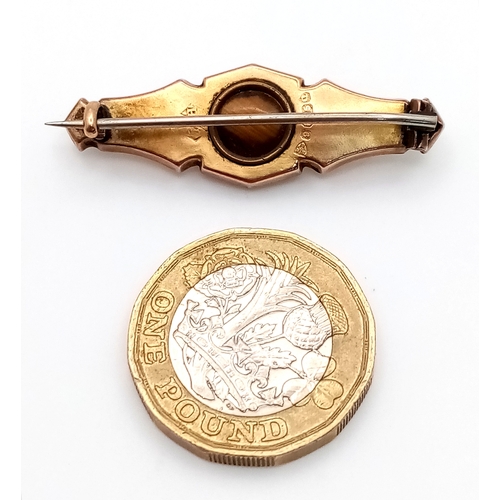 765 - An Antique 9K Yellow Diamond Brooch. Pin has been replaced. 4cm. 2.2g total weight.