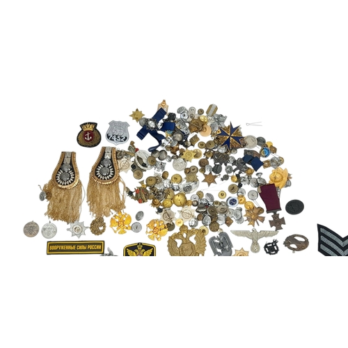 813 - A Huge Collection of Reproduction Military Metal and Textile  Badges. These were used by an amateur ... 