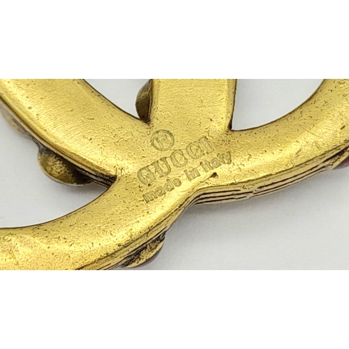 878 - A vintage Gucci stone set dress brooch. 5 X 4 cm.