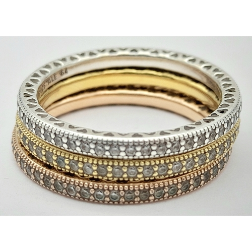 906 - A collection of 3 Pandora tri color gilded silver stone set rings. Total weight 6.7G. Sizes: 2 V and... 