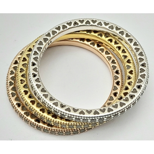 906 - A collection of 3 Pandora tri color gilded silver stone set rings. Total weight 6.7G. Sizes: 2 V and... 