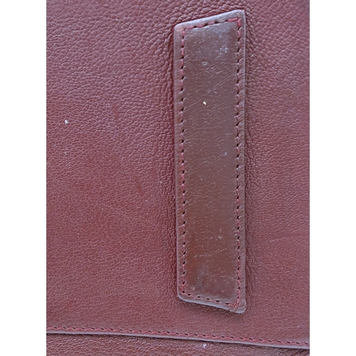 994 - A Givenchy Medium Antigona Tote Bag. Burgundy grained leather exterior with silver-toned hardware, t... 