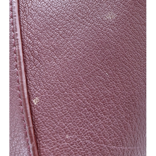 994 - A Givenchy Medium Antigona Tote Bag. Burgundy grained leather exterior with silver-toned hardware, t... 