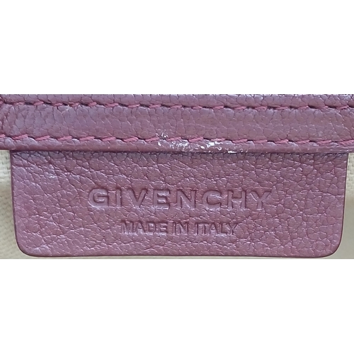 994 - A Givenchy Medium Antigona Tote Bag. Burgundy grained leather exterior with silver-toned hardware, t... 