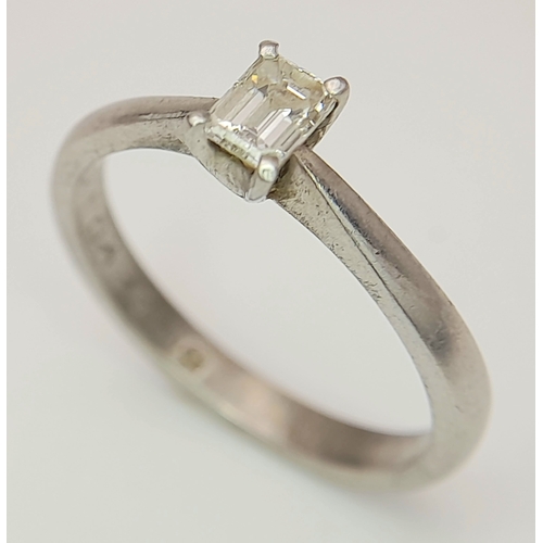 889 - A PLATINUM AND DIAMOND SOLITAIRE RING WITH AN EMERALD CUT DIAMOND .       4.2gms    size N . Ref: ST... 