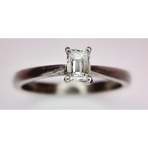 889 - A PLATINUM AND DIAMOND SOLITAIRE RING WITH AN EMERALD CUT DIAMOND .       4.2gms    size N . Ref: ST... 
