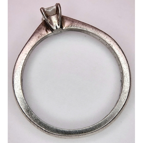 889 - A PLATINUM AND DIAMOND SOLITAIRE RING WITH AN EMERALD CUT DIAMOND .       4.2gms    size N . Ref: ST... 