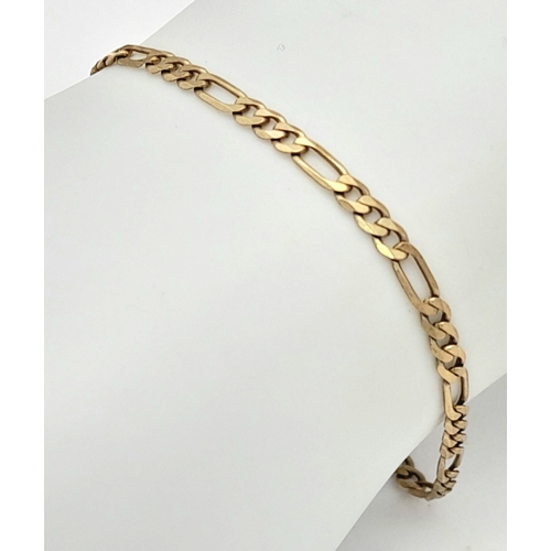 564 - A 9K Yellow Gold Figaro Link Bracelet with safety chain. 18cm. 3.3g