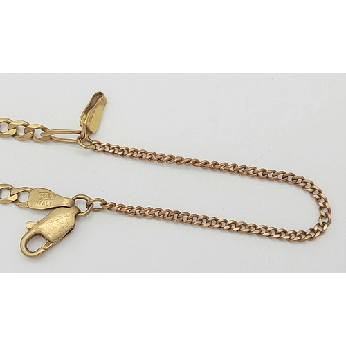 564 - A 9K Yellow Gold Figaro Link Bracelet with safety chain. 18cm. 3.3g