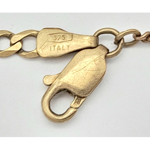 564 - A 9K Yellow Gold Figaro Link Bracelet with safety chain. 18cm. 3.3g