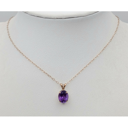 618 - A 9K Gold Amethyst Pendant on a 9K Yellow Gold Disappearing Necklace. 15mm and 42cm. 1g total weight... 