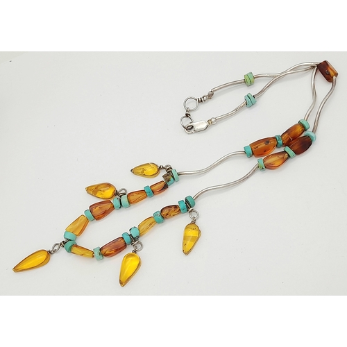 850 - An unique 925 silver Turquoise and Amber colour bead necklace. Total weight 11G. Total length 44cm.