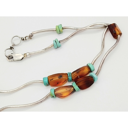 850 - An unique 925 silver Turquoise and Amber colour bead necklace. Total weight 11G. Total length 44cm.